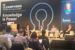 CleanPower conference panel discussion with four speakers seated on stage discussing energy innovation